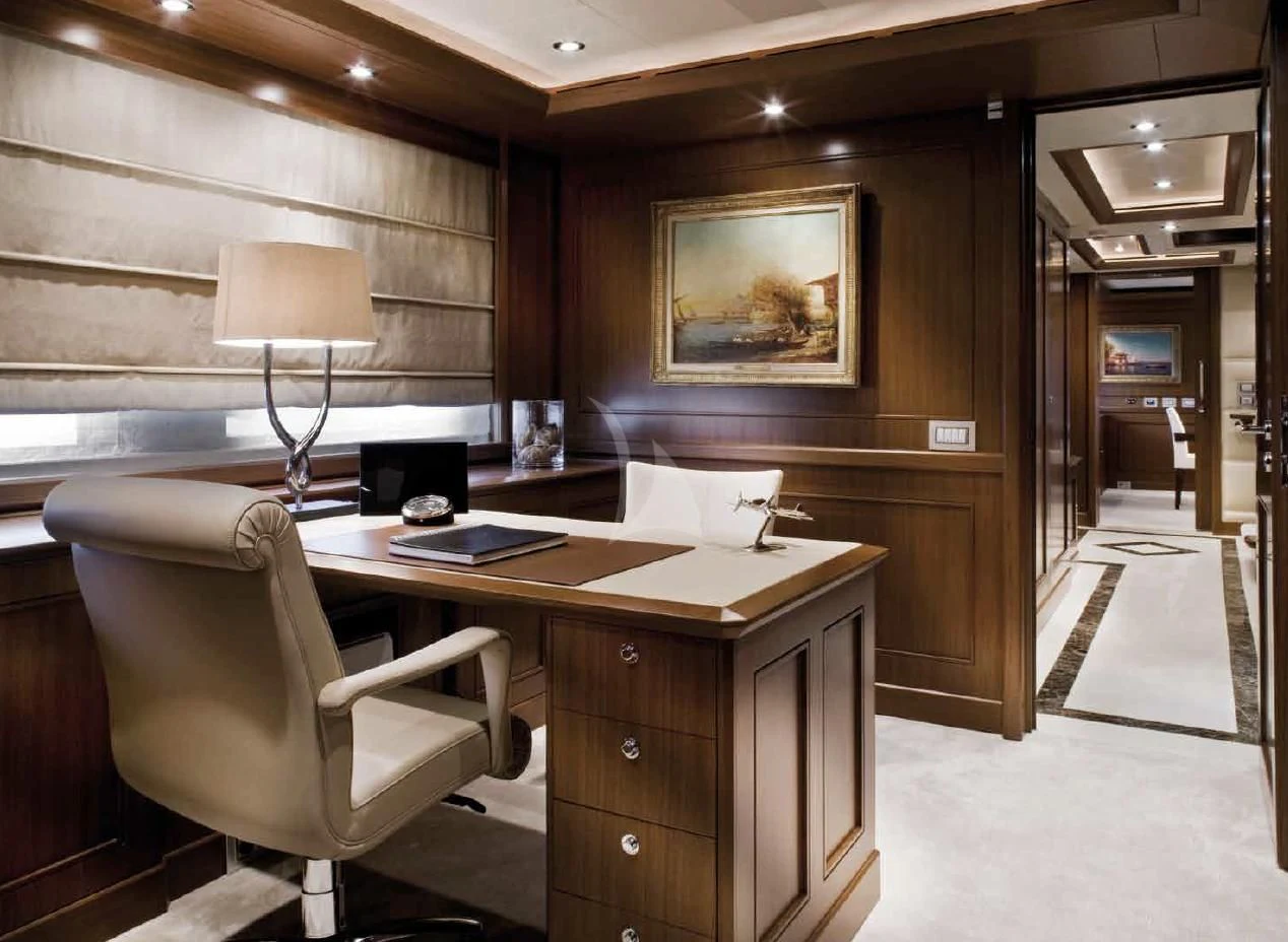 a room with a desk and a lamp aboard O'LION Yacht for Sale