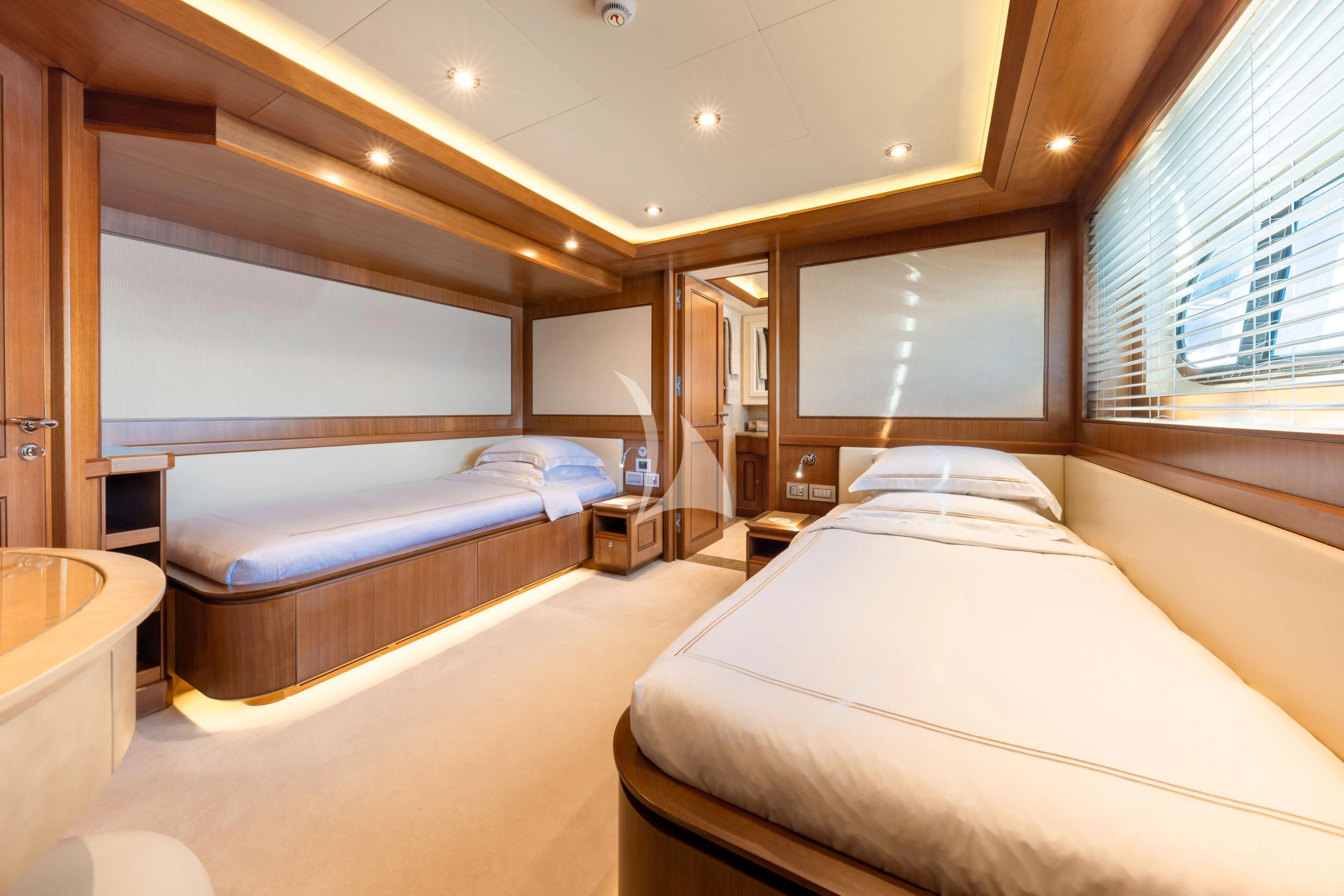 a room with two beds aboard O'LION Yacht for Sale