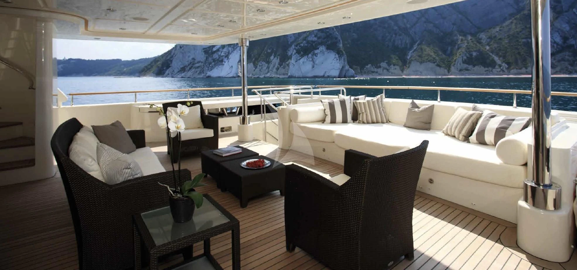 a room with a couch and a table and a large window aboard O'LION Yacht for Sale