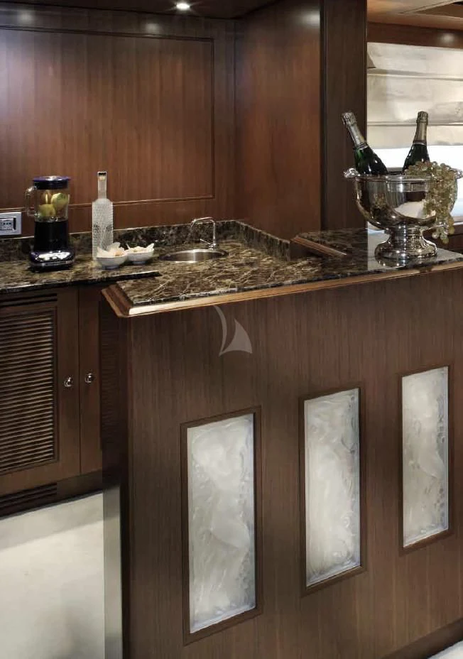 a kitchen counter with a sink and cabinets aboard O'LION Yacht for Sale