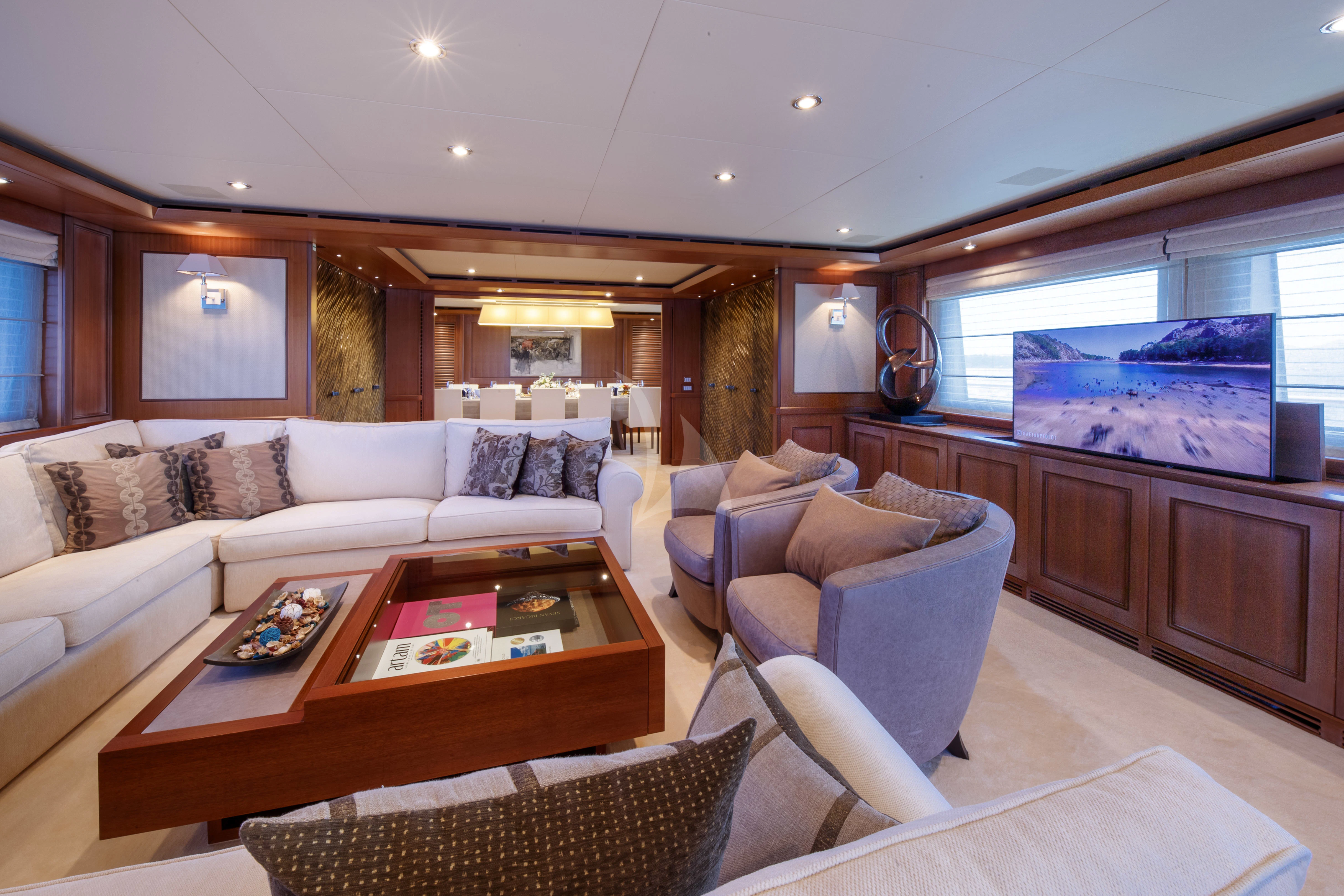 a living room with a large window aboard O'LION Yacht for Sale