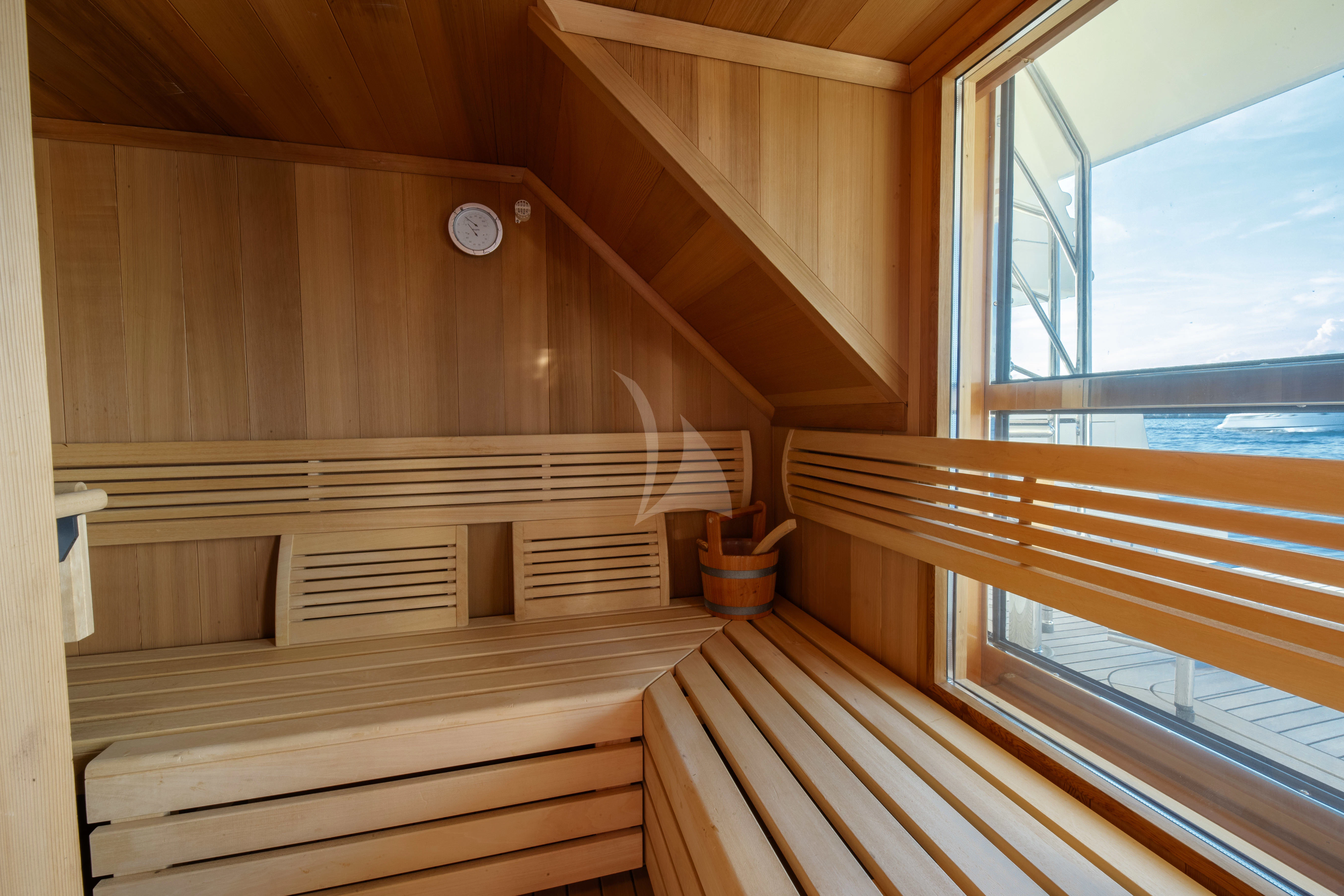 a wood room with a wood railing and a window aboard O'LION Yacht for Sale