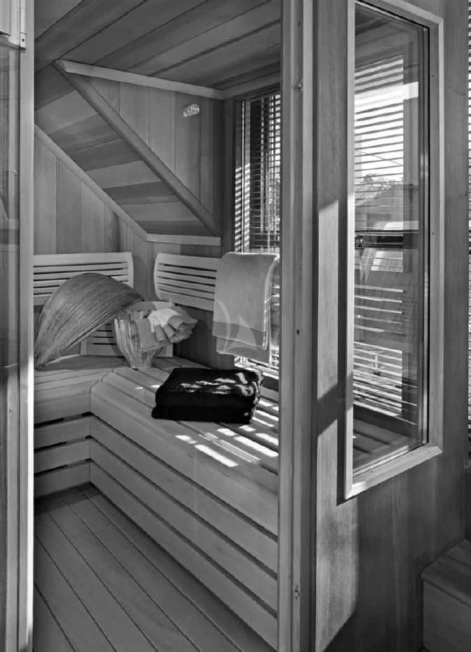 a person sleeping on a bed aboard O'LION Yacht for Sale