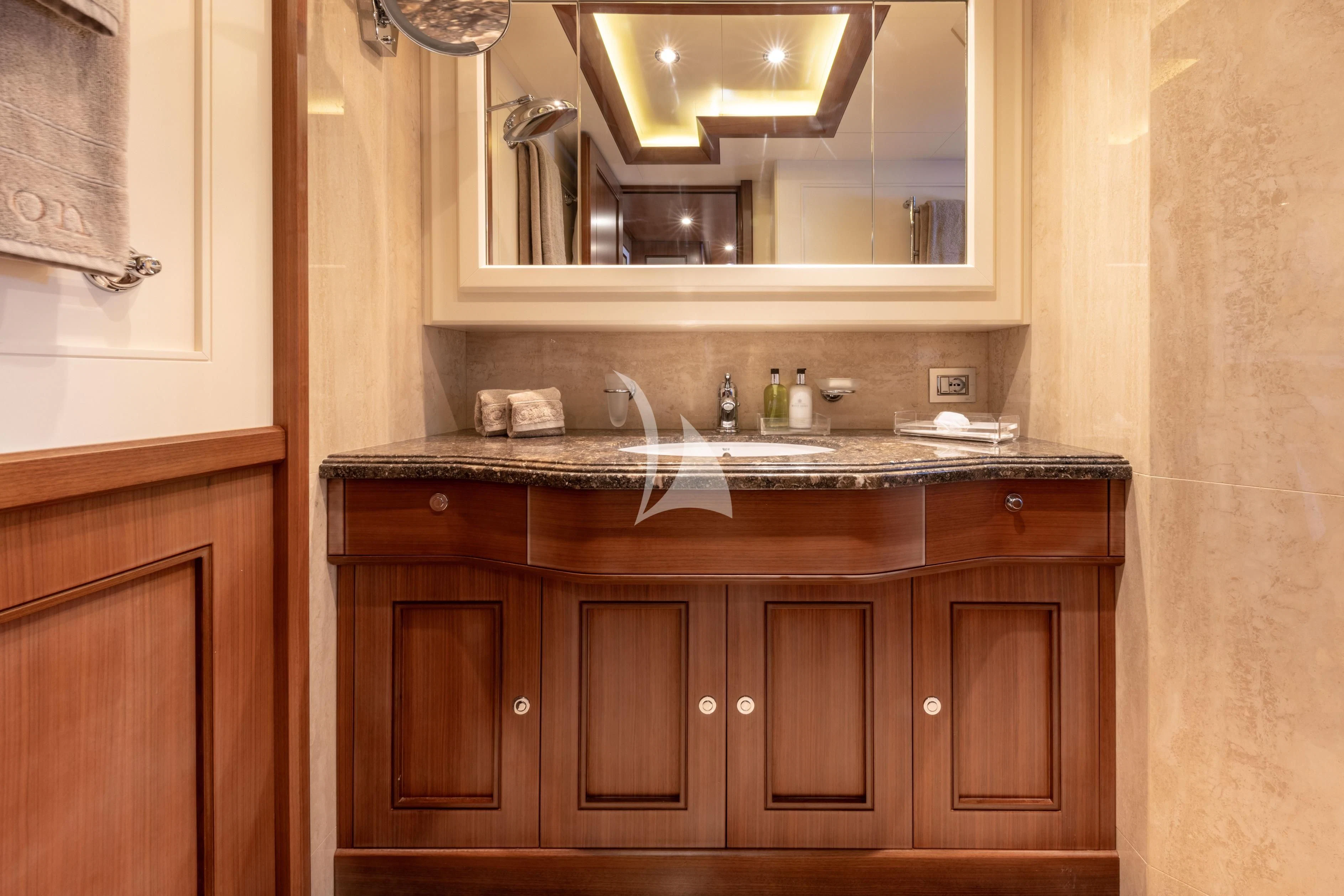 a bathroom with a sink and a mirror aboard O'LION Yacht for Sale