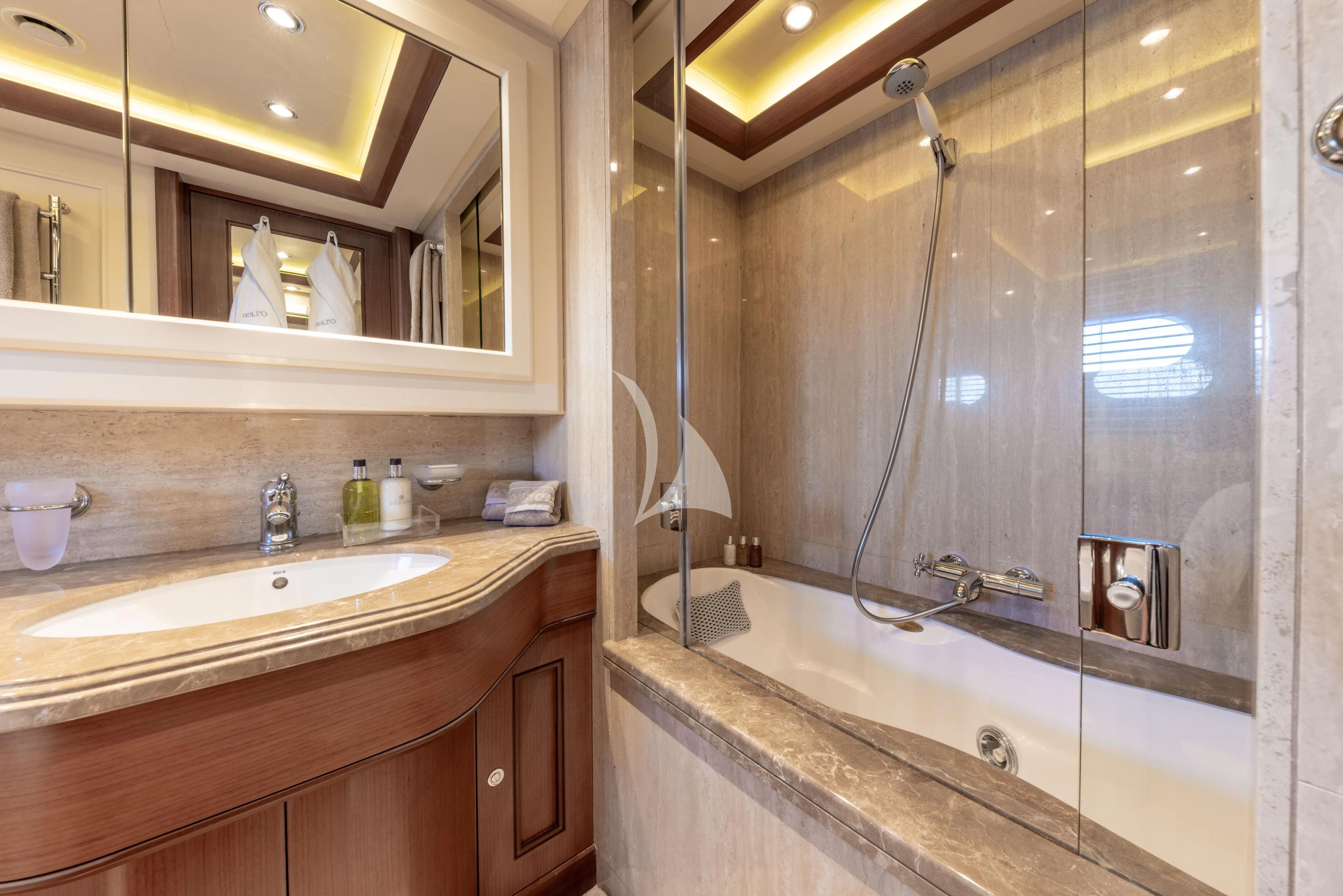 a bathroom with a large mirror aboard O'LION Yacht for Sale