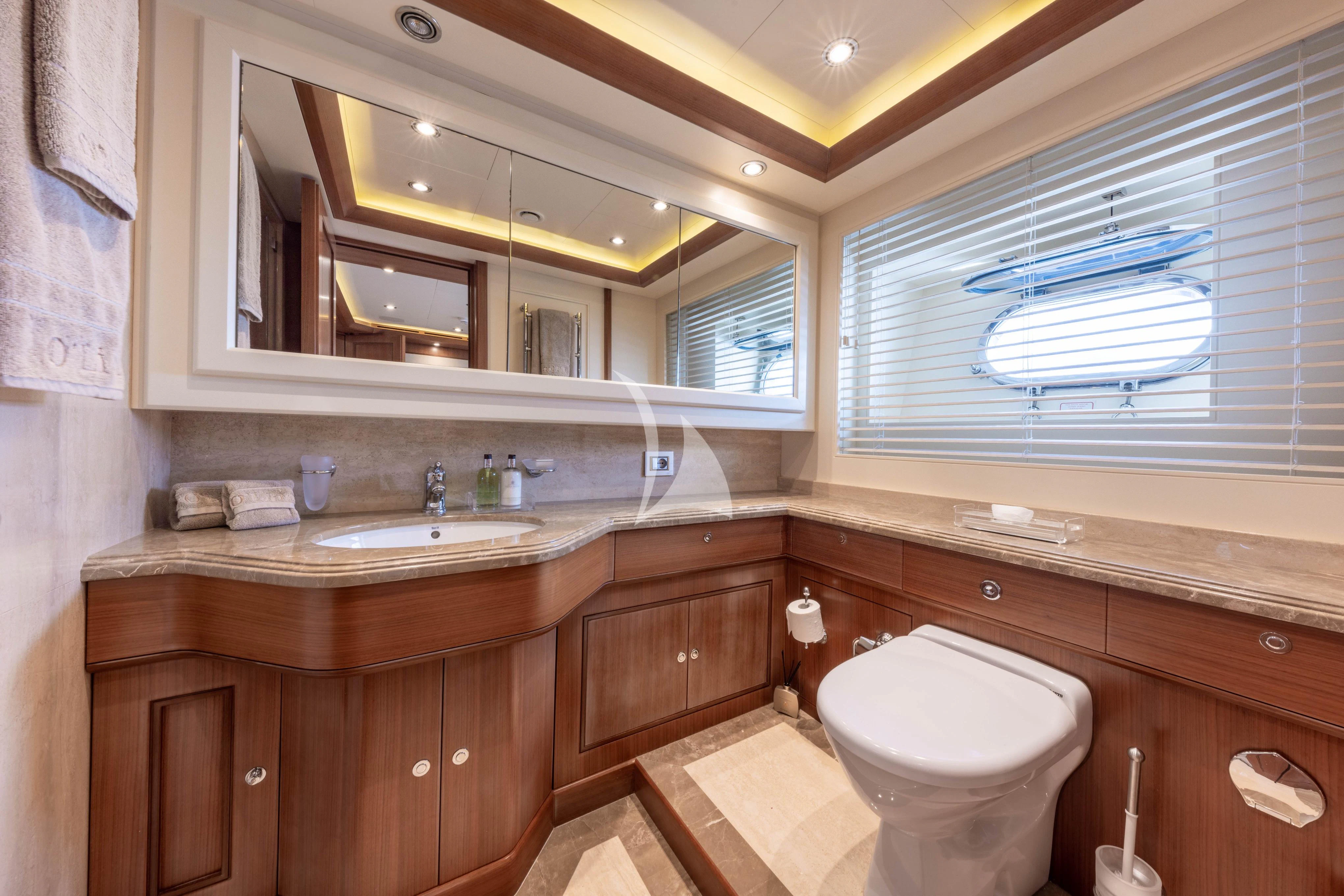 a bathroom with a sink and a toilet aboard O'LION Yacht for Sale