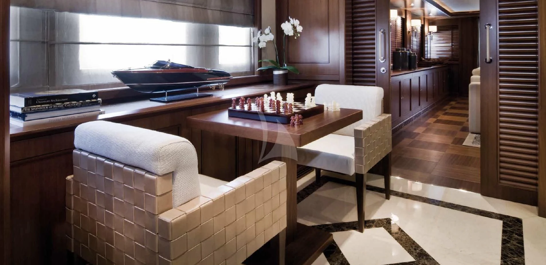 a room with a couch and a piano aboard O'LION Yacht for Sale