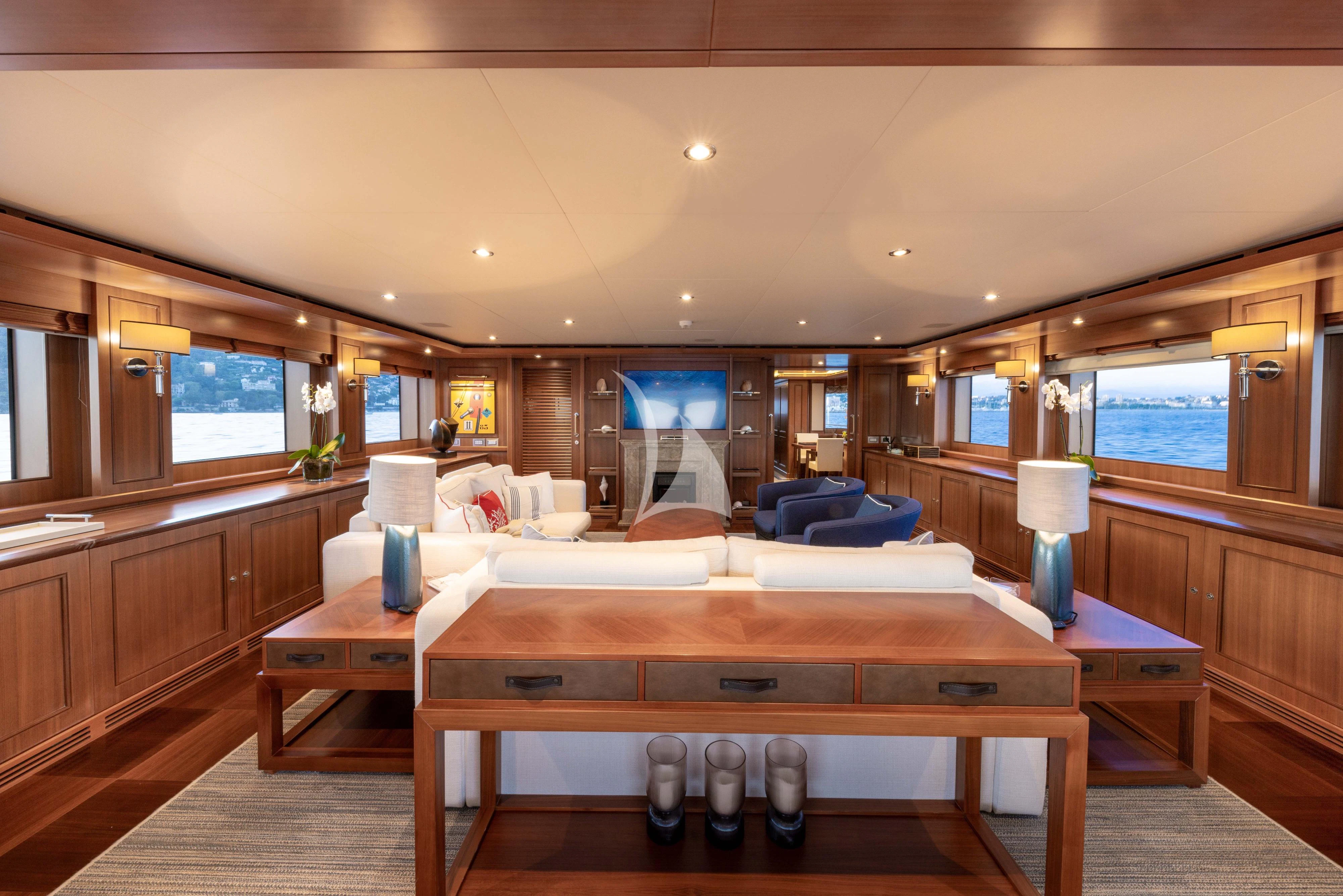 a room with a bed and a desk aboard O'LION Yacht for Sale