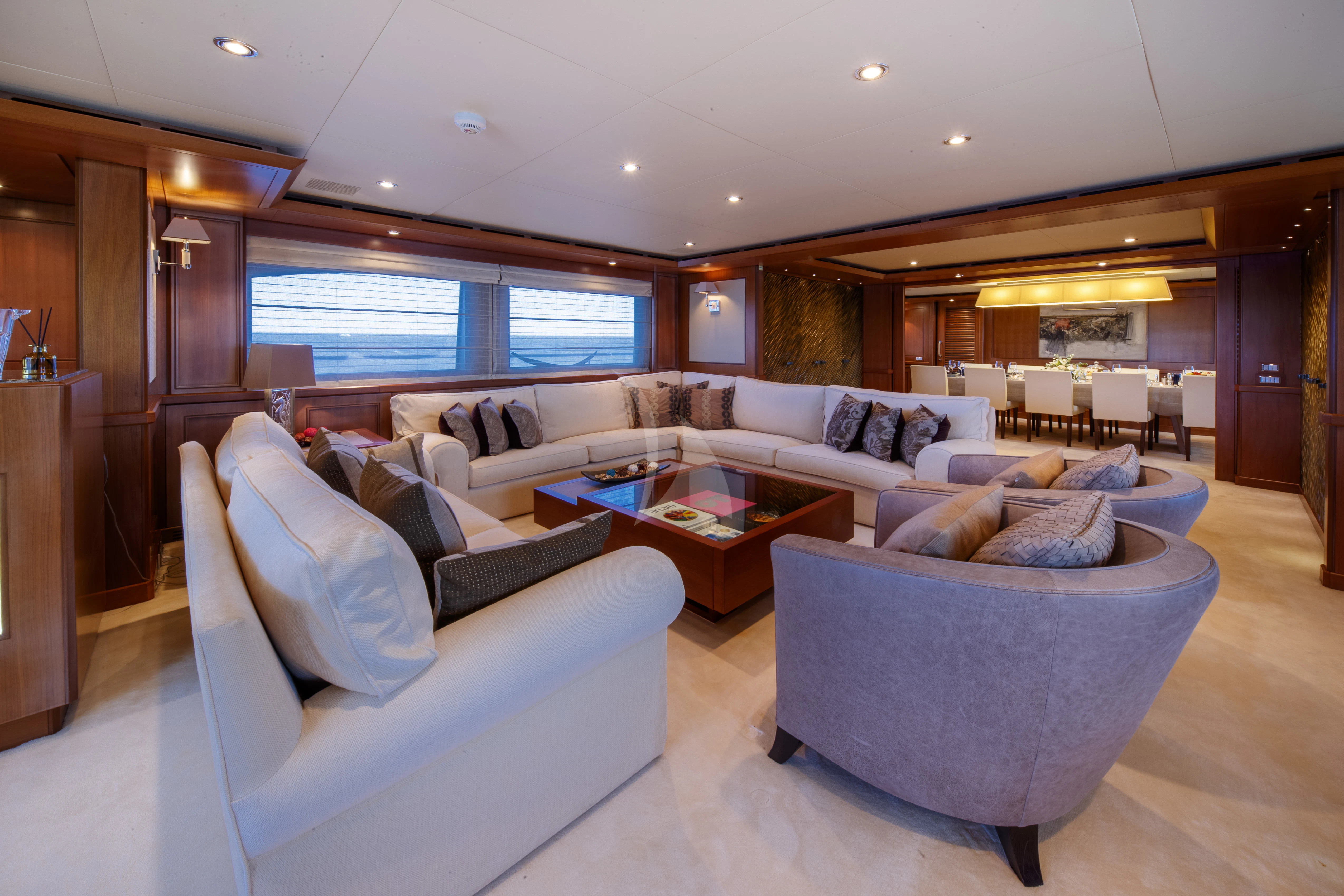 a living room with a large window aboard O'LION Yacht for Sale