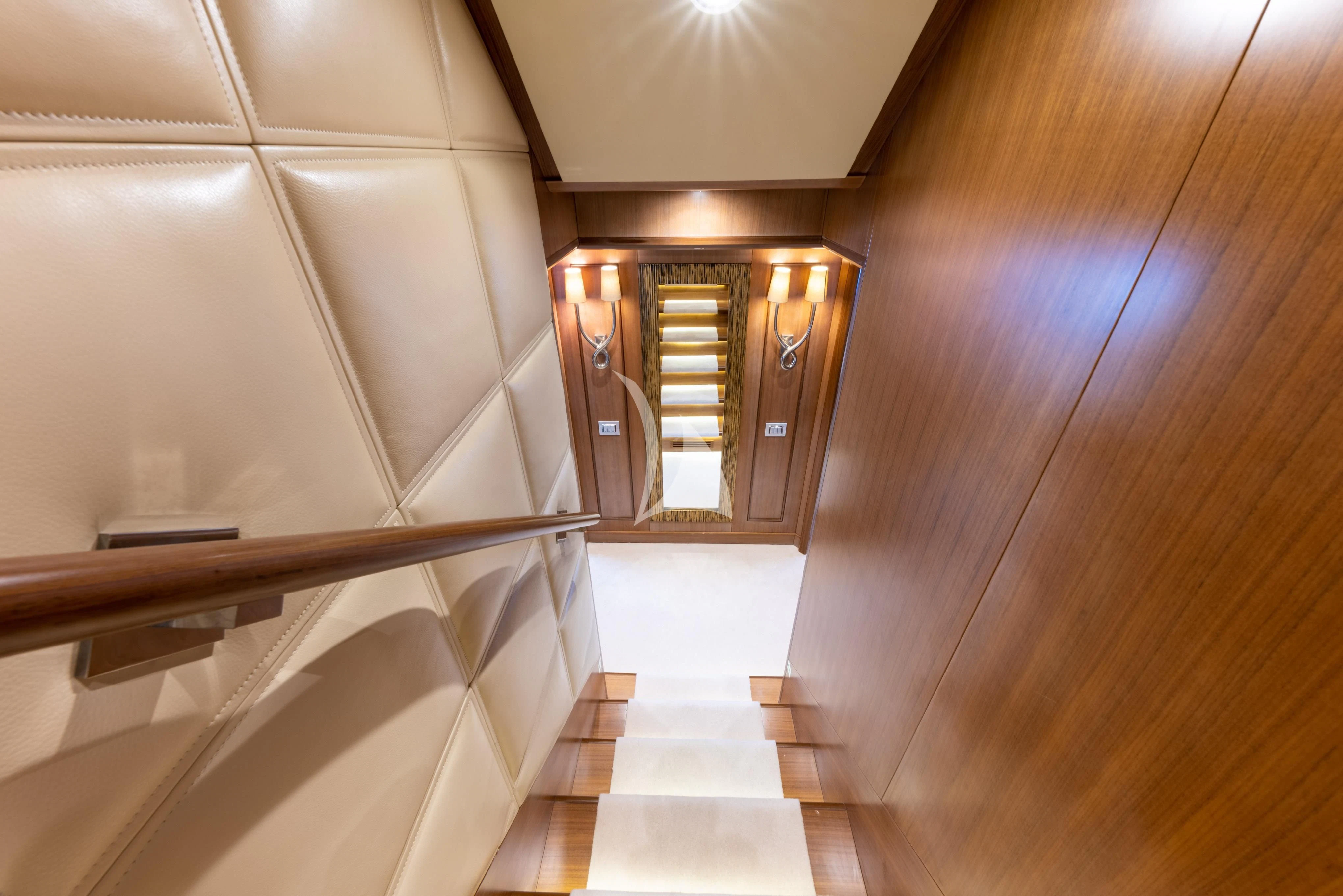 a hallway with a glass door aboard O'LION Yacht for Sale