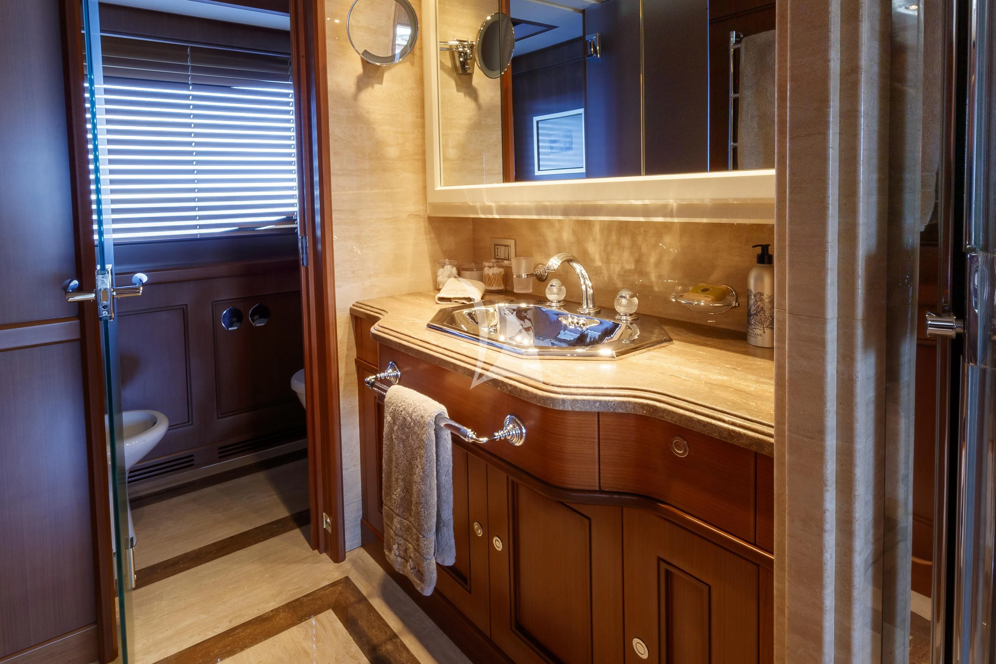 a bathroom with a sink and cabinets aboard O'LION Yacht for Sale