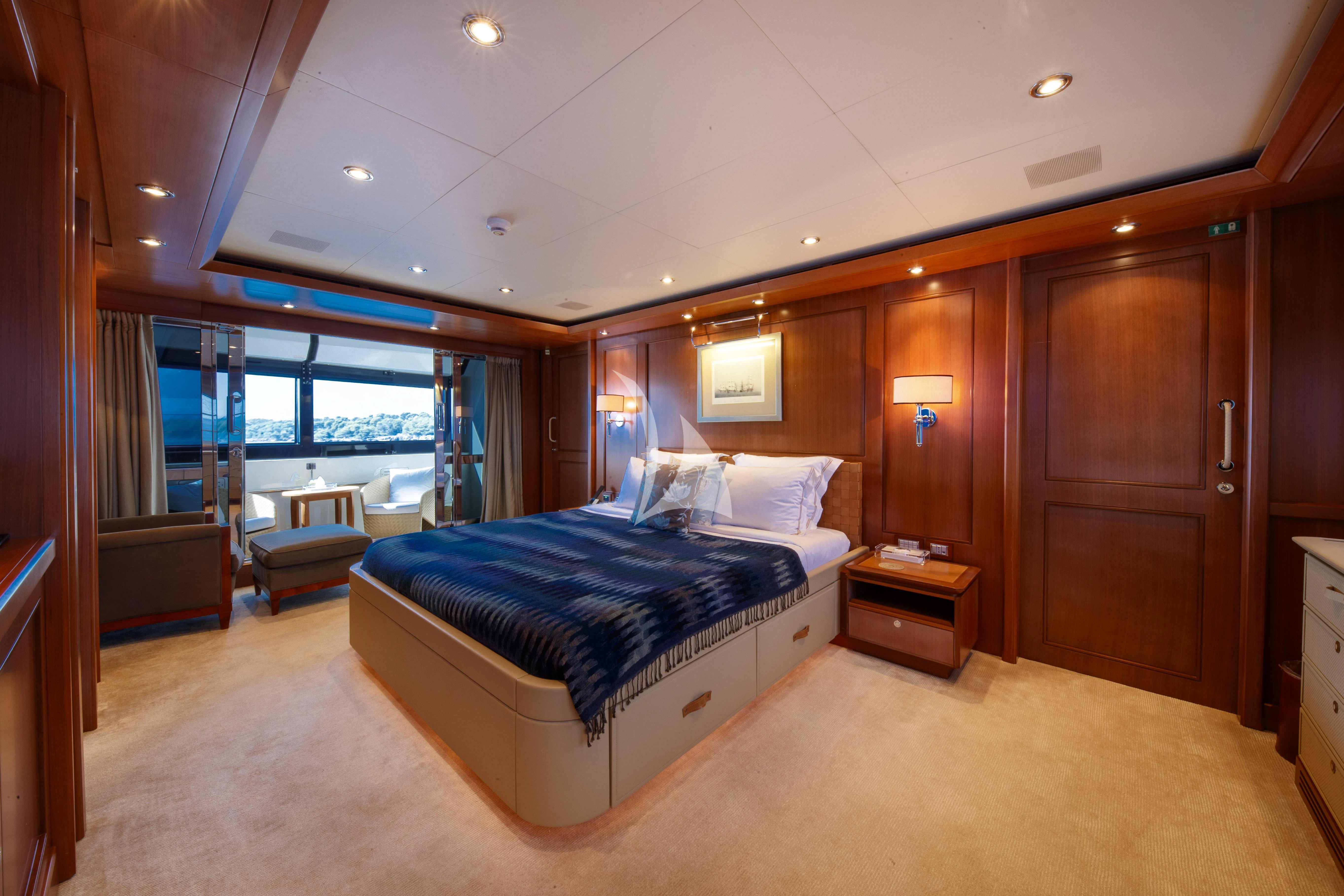 a large bedroom with a large bed aboard O'LION Yacht for Sale