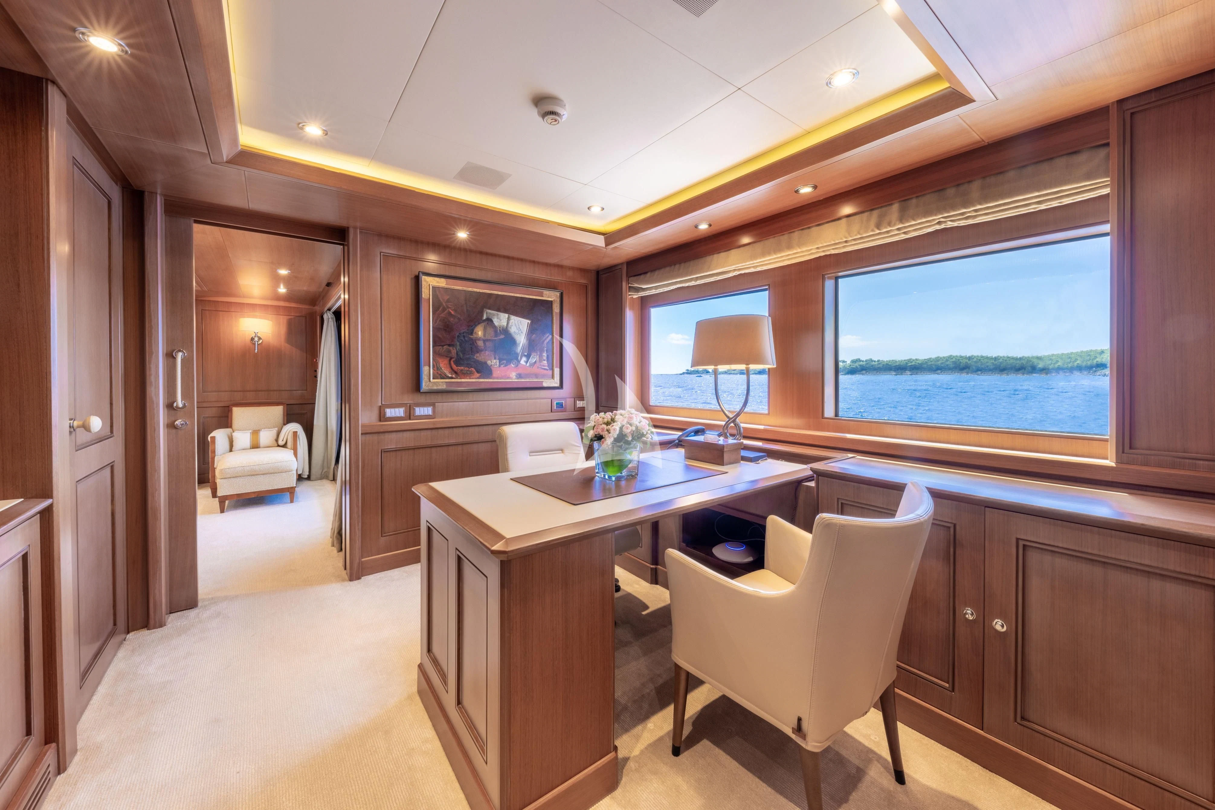 a room with a desk and a window aboard O'LION Yacht for Sale