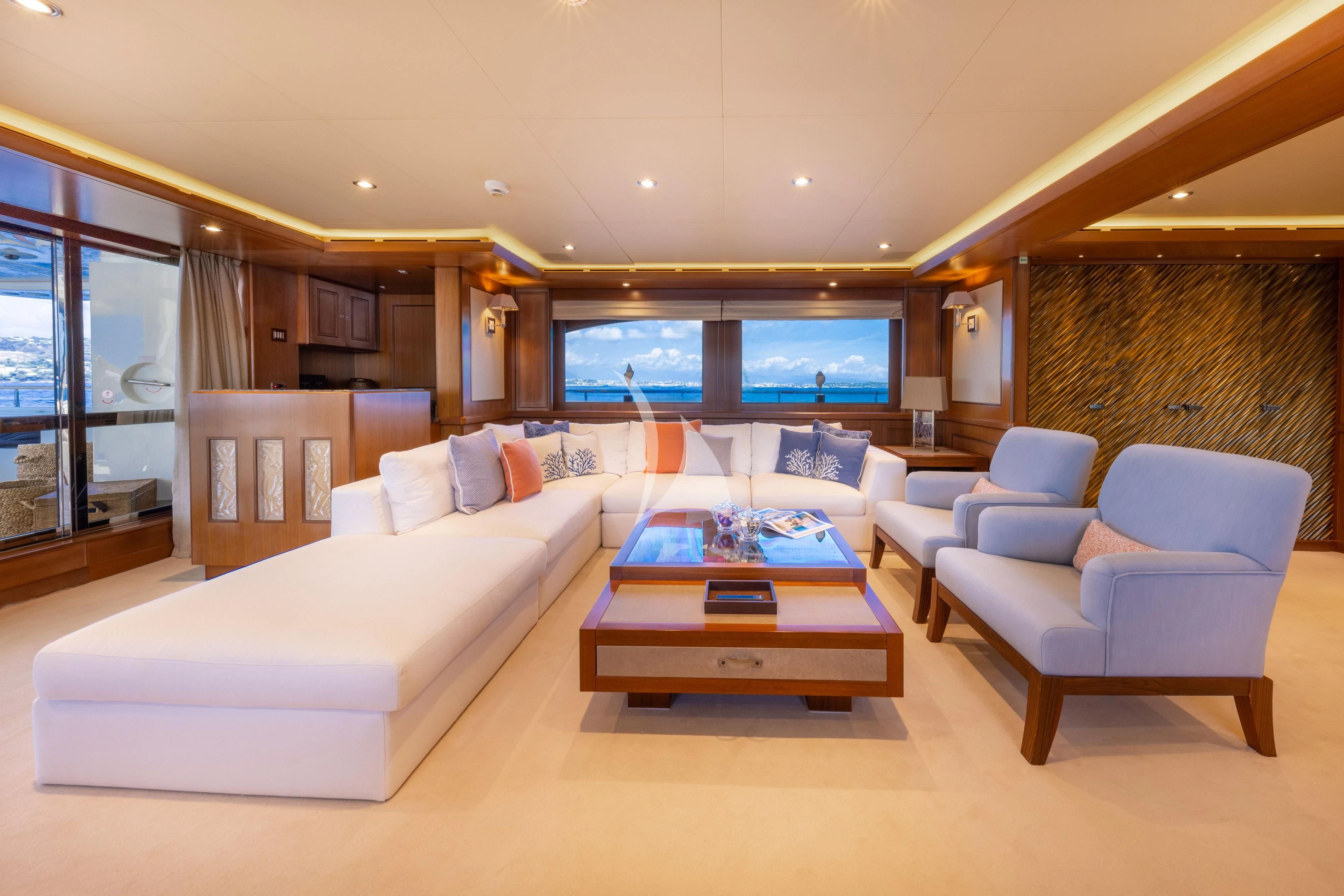 a living room with a large screen aboard O'LION Yacht for Sale
