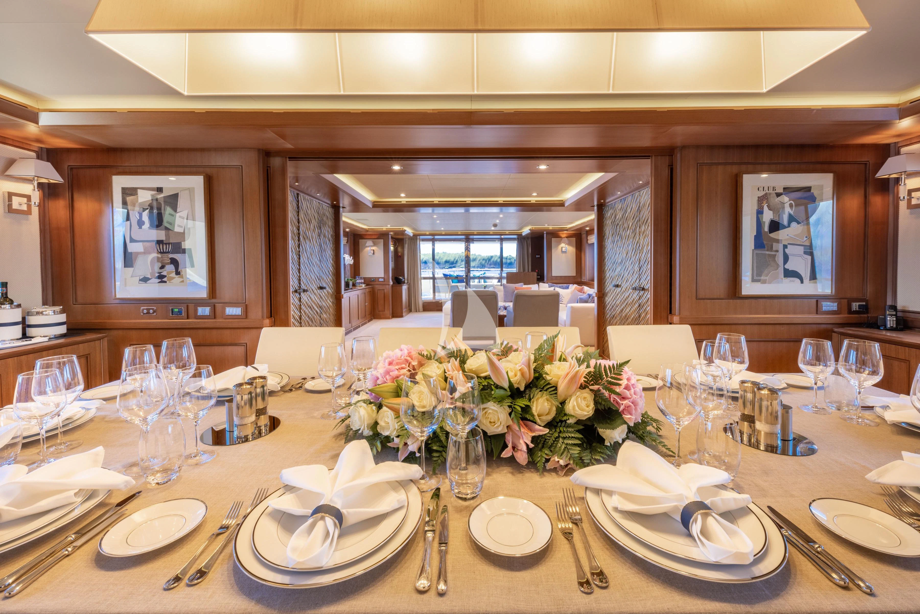 a table set with place settings aboard O'LION Yacht for Sale