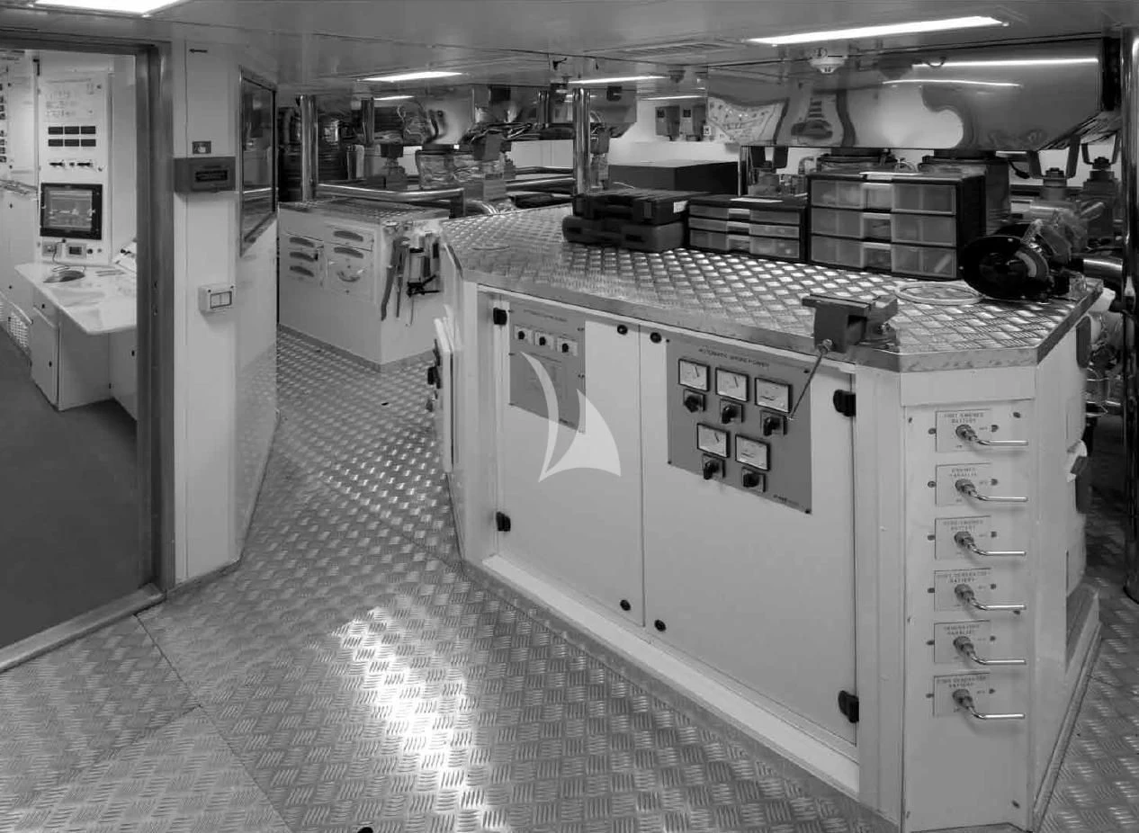 a large kitchen with white cabinets aboard O'LION Yacht for Sale