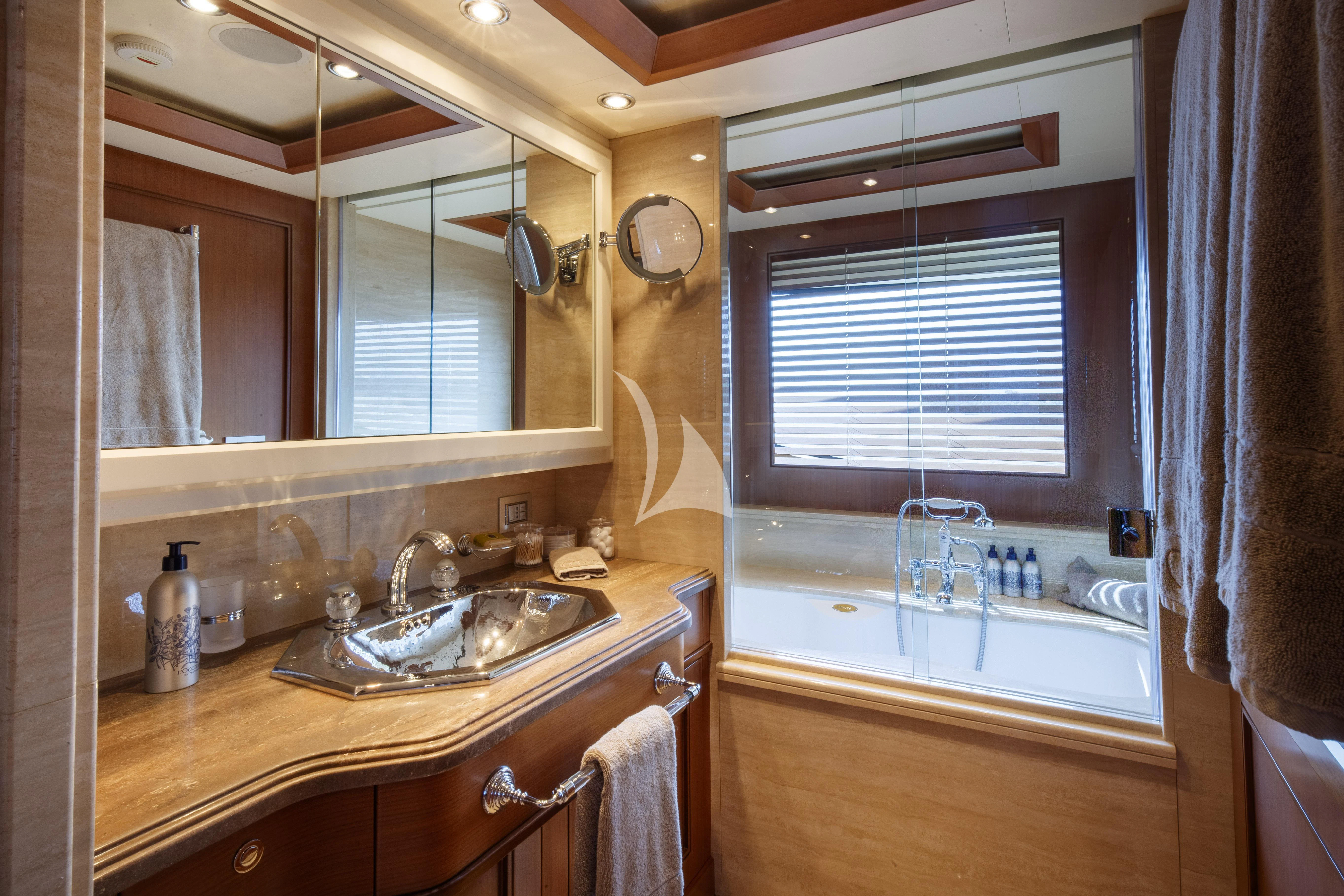a bathroom with a sink and a mirror aboard O'LION Yacht for Sale