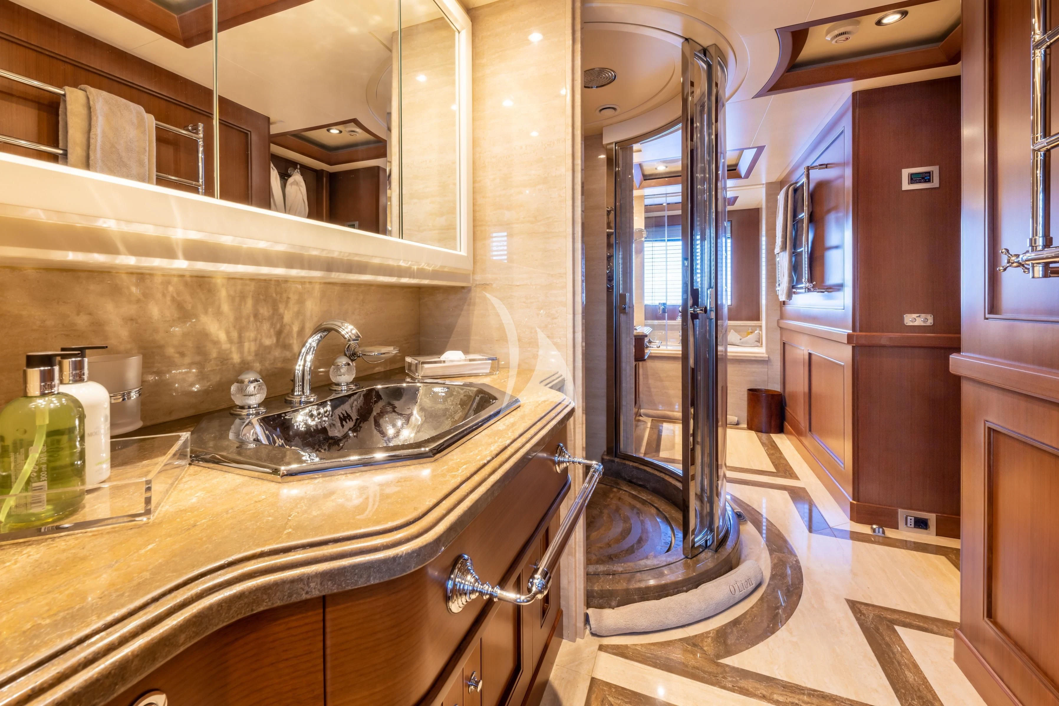 a bathroom with a sink and a mirror aboard O'LION Yacht for Sale