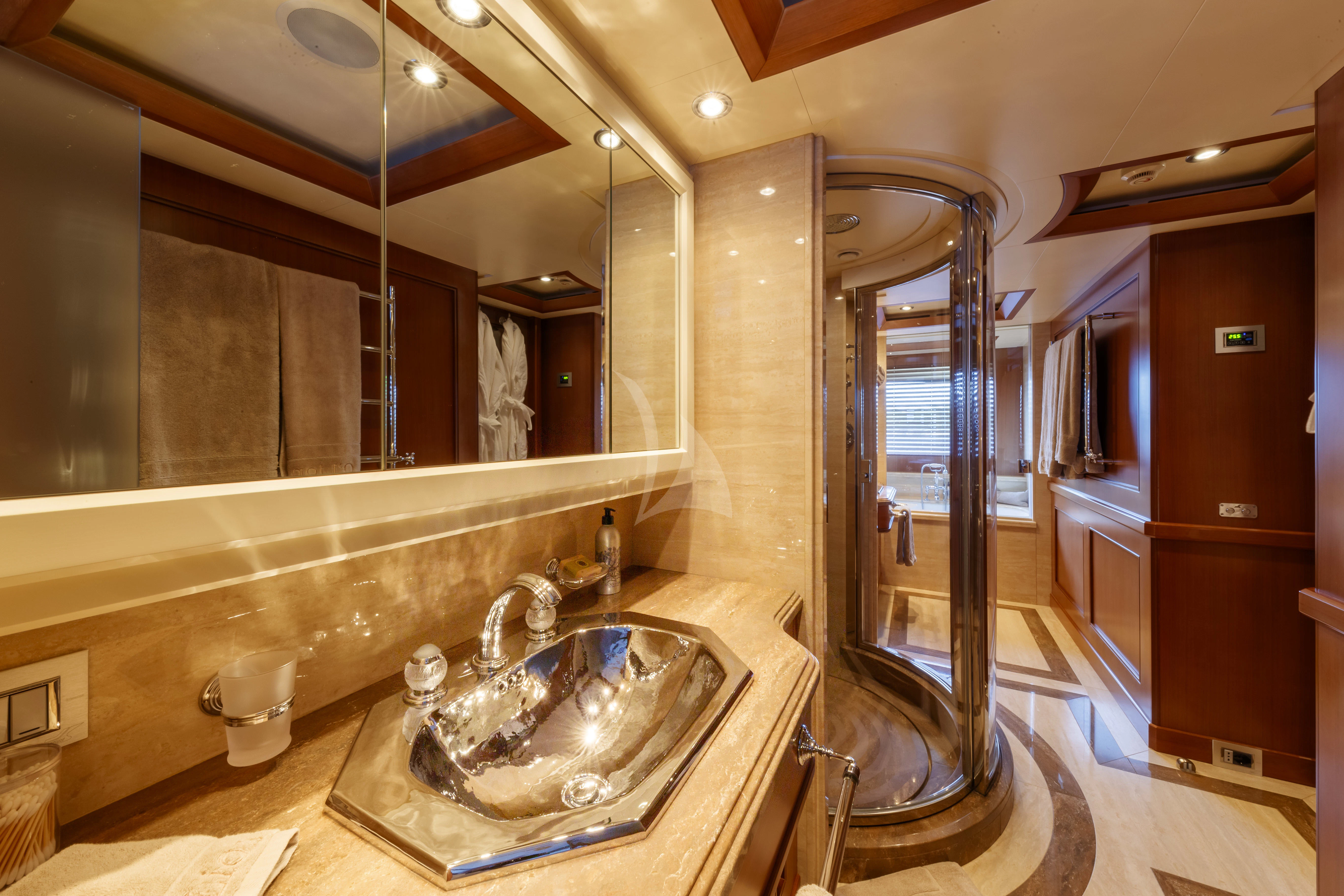 a bathroom with a large mirror aboard O'LION Yacht for Sale
