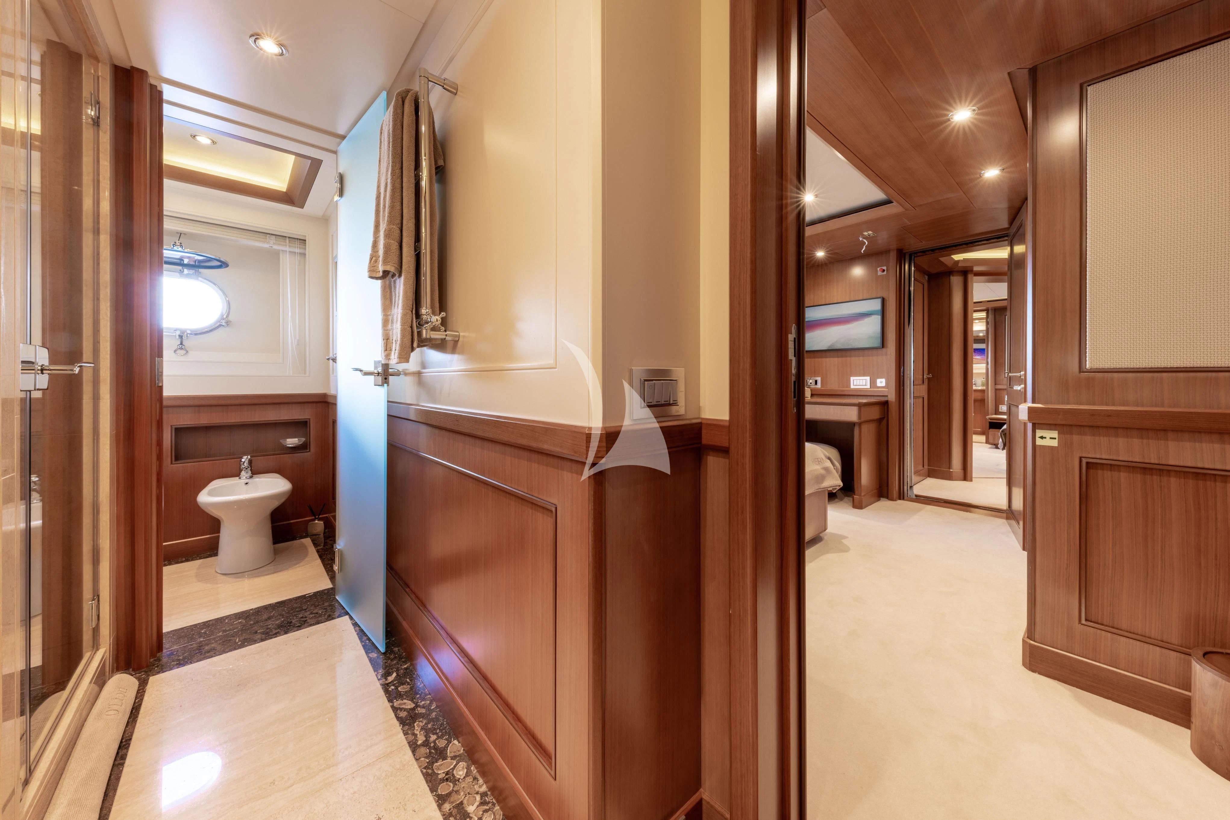 a bathroom with a toilet and a sink aboard O'LION Yacht for Sale
