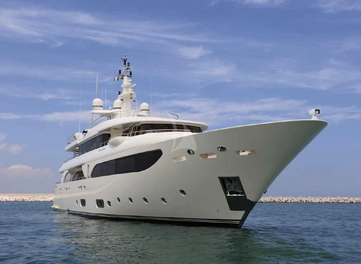 a white yacht in the water aboard O'LION Yacht for Sale