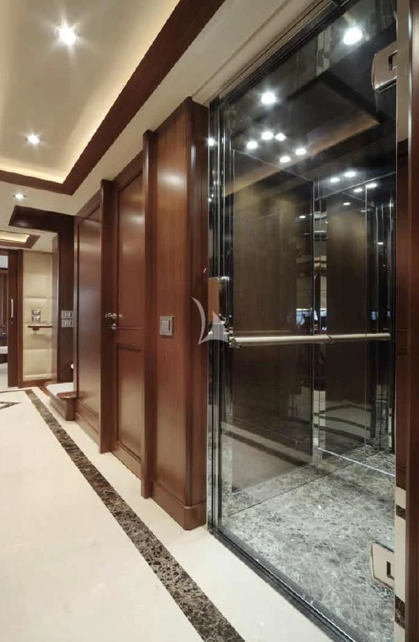 a large elevator with glass doors aboard O'LION Yacht for Sale