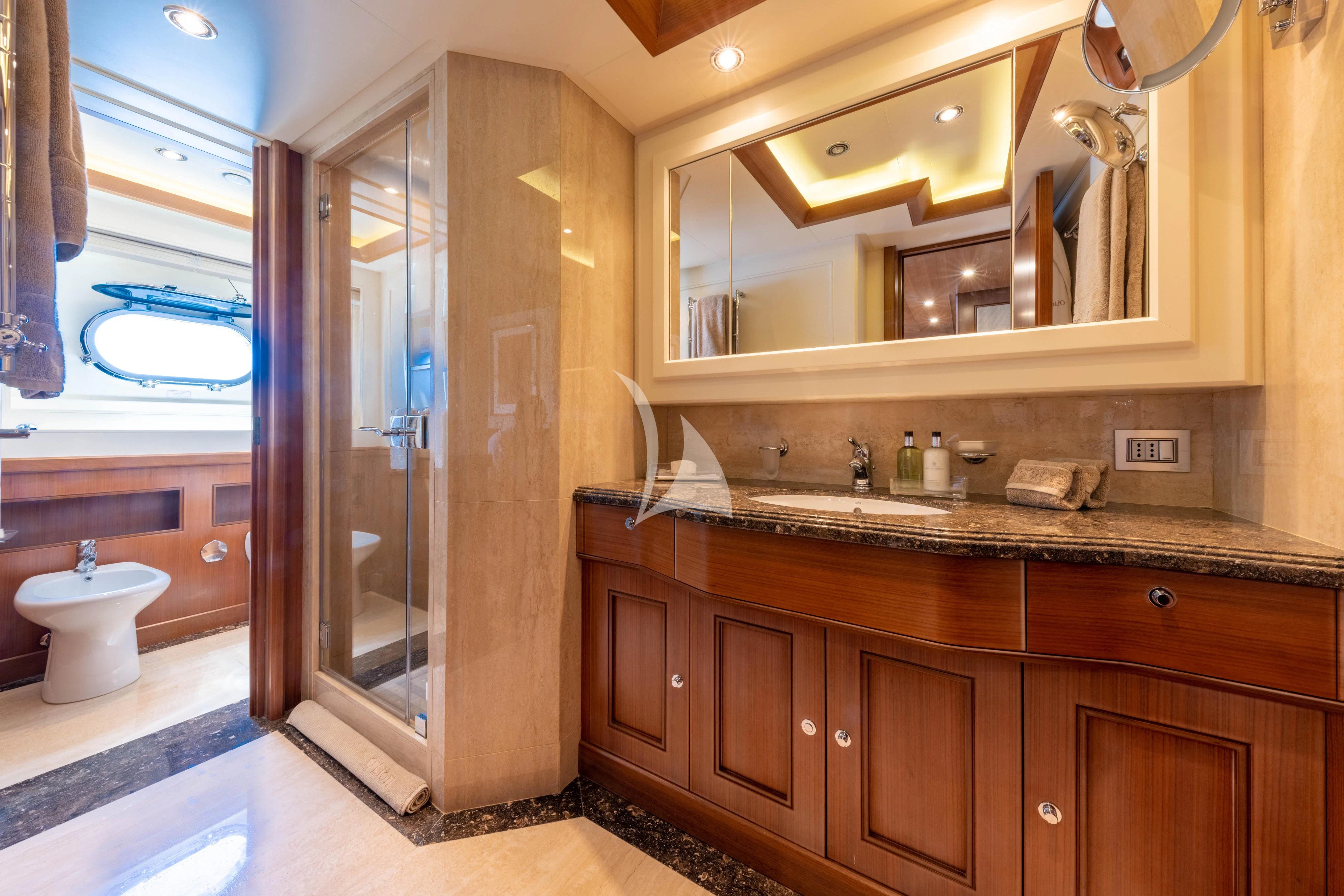 a bathroom with a glass shower aboard O'LION Yacht for Sale