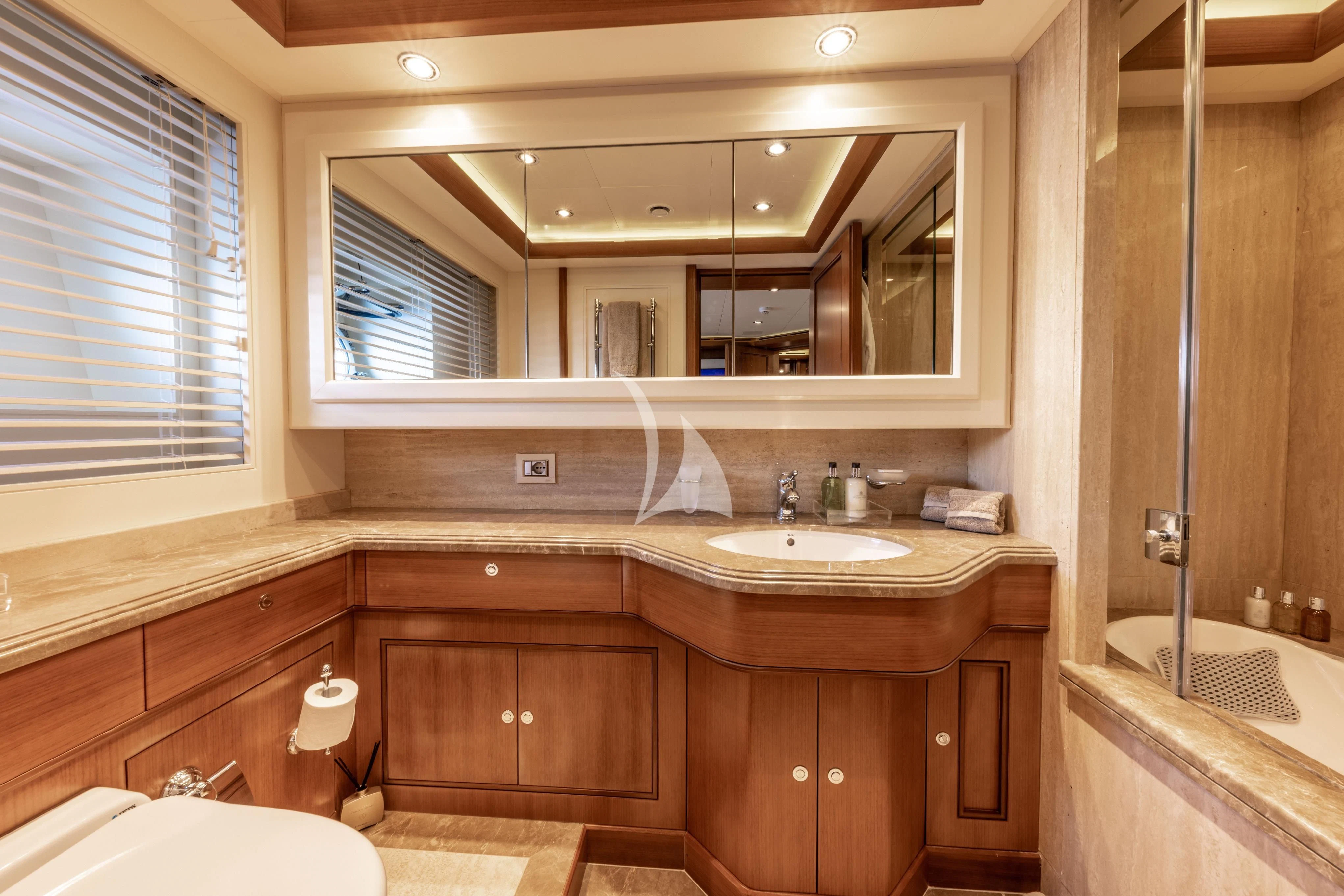 a bathroom with a sink and a mirror aboard O'LION Yacht for Sale