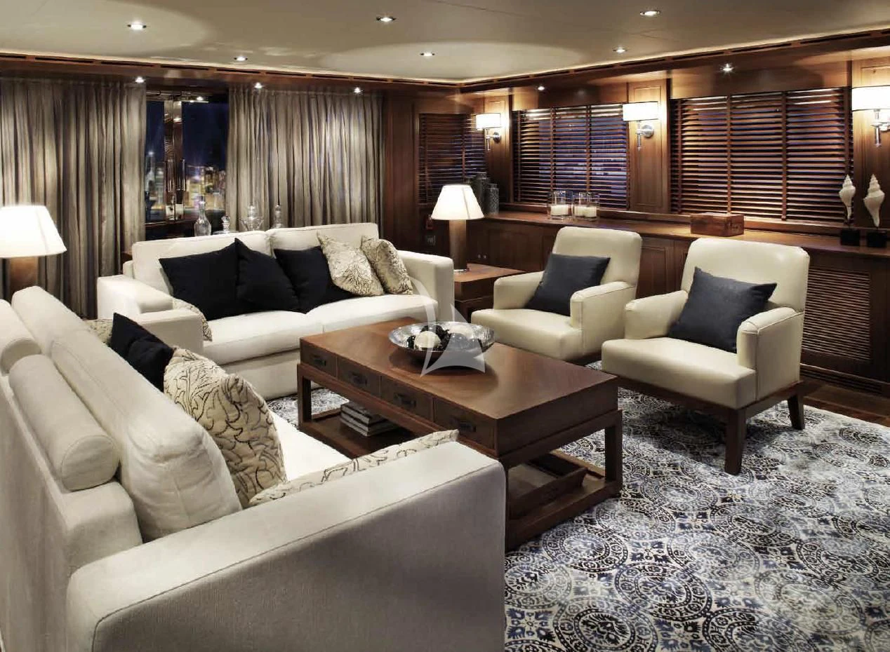 a living room with a couch and a coffee table aboard O'LION Yacht for Sale