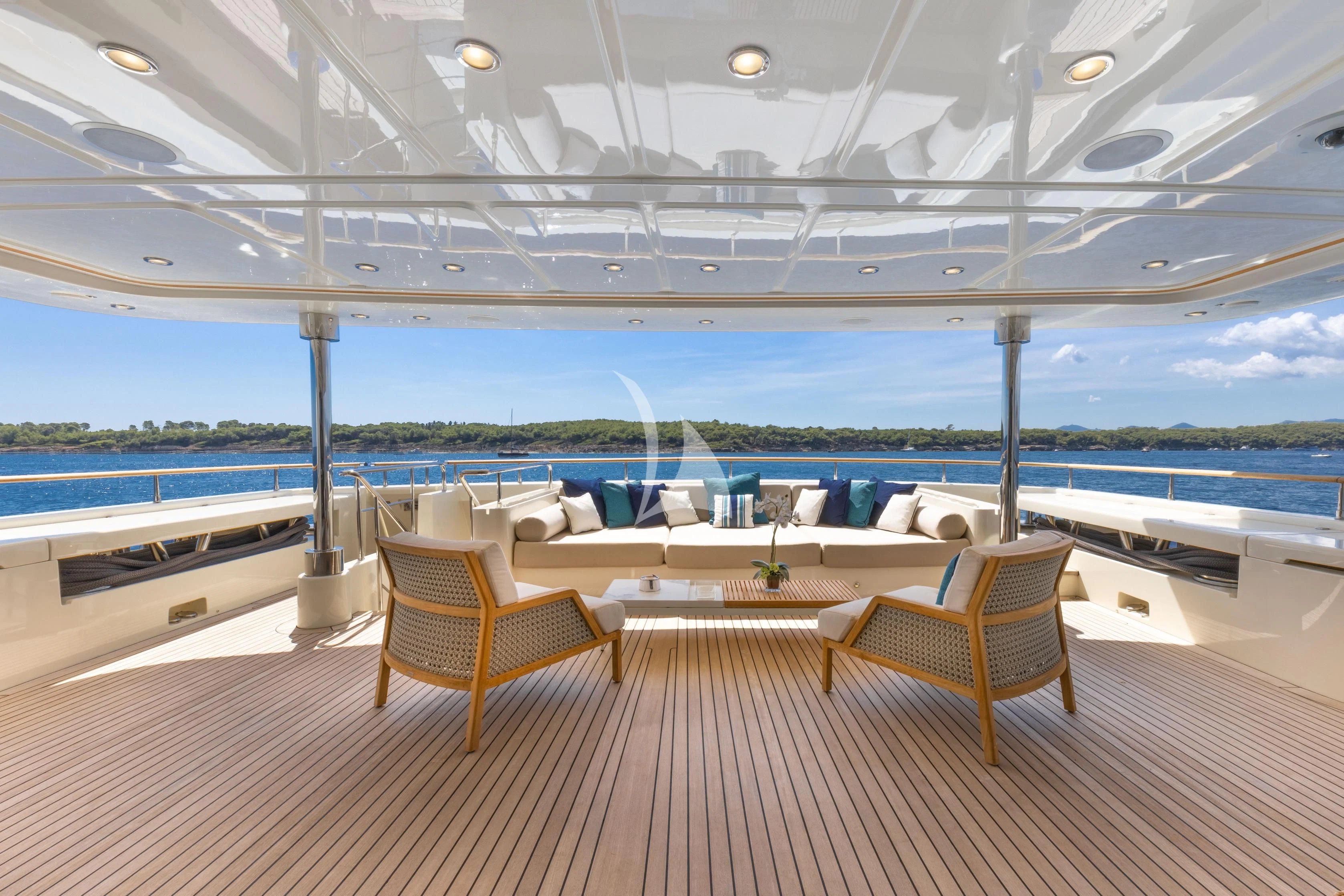 a room with a table and chairs aboard O'LION Yacht for Sale