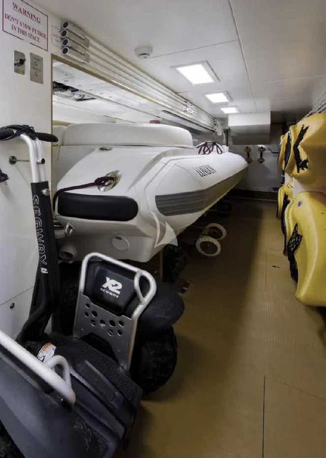 a jet plane parked in a swinger aboard O'LION Yacht for Sale