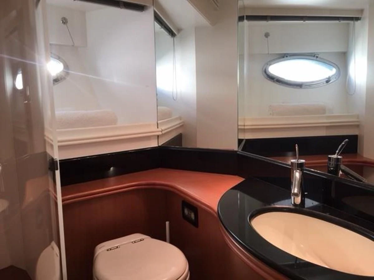 a bathroom with a sink and a mirror aboard CHAKLOO Yacht for Sale
