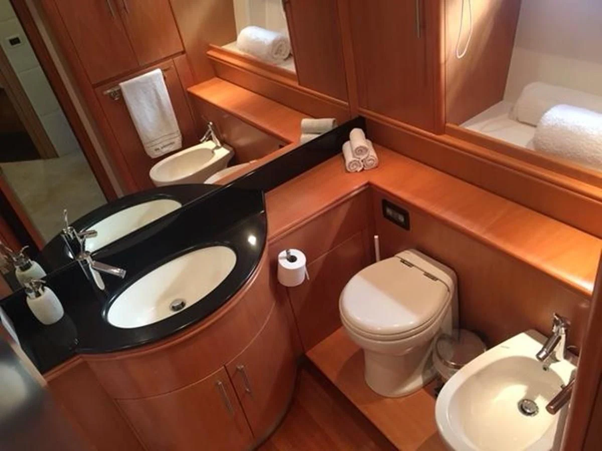 a bathroom with a sink and toilet aboard CHAKLOO Yacht for Sale