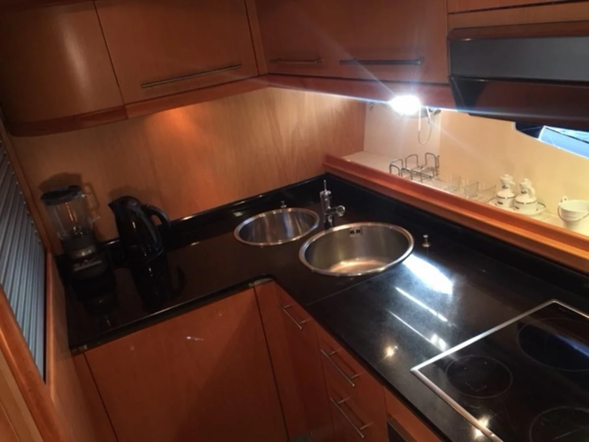 a kitchen with a sink and a stove aboard CHAKLOO Yacht for Sale
