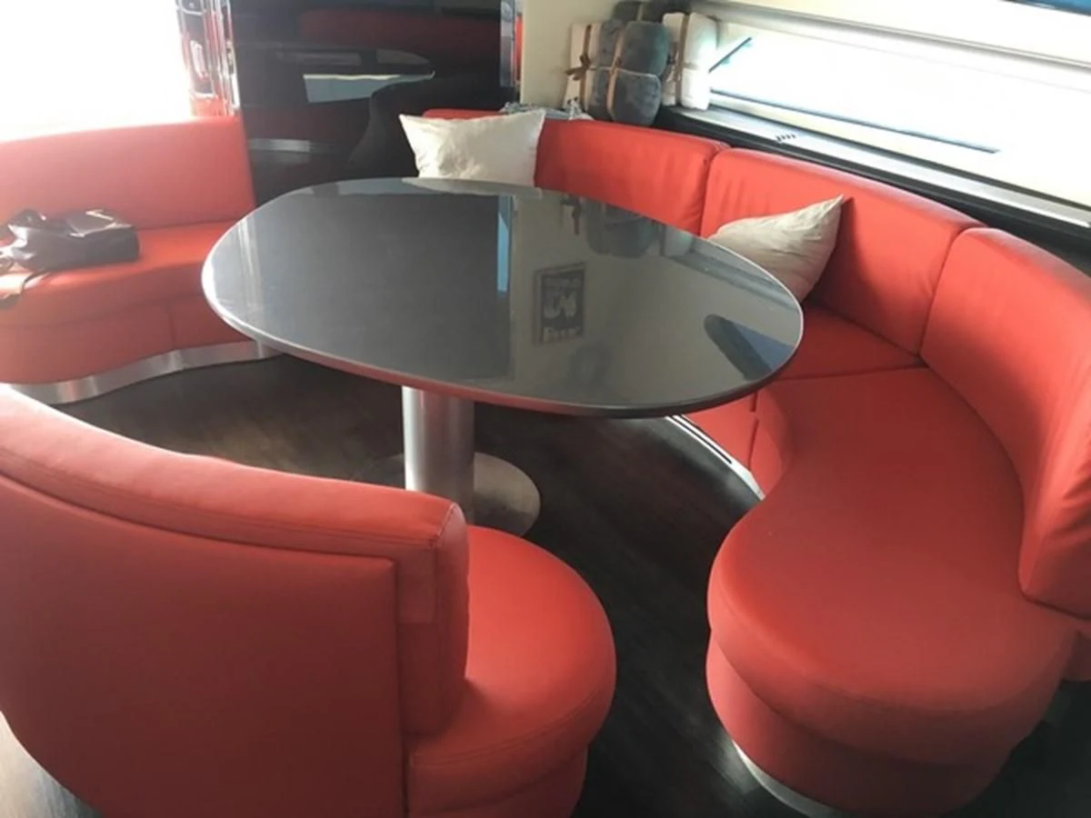 a table with a laptop on it aboard CHAKLOO Yacht for Sale