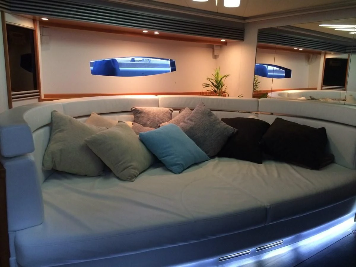 a couch with pillows aboard CHAKLOO Yacht for Sale