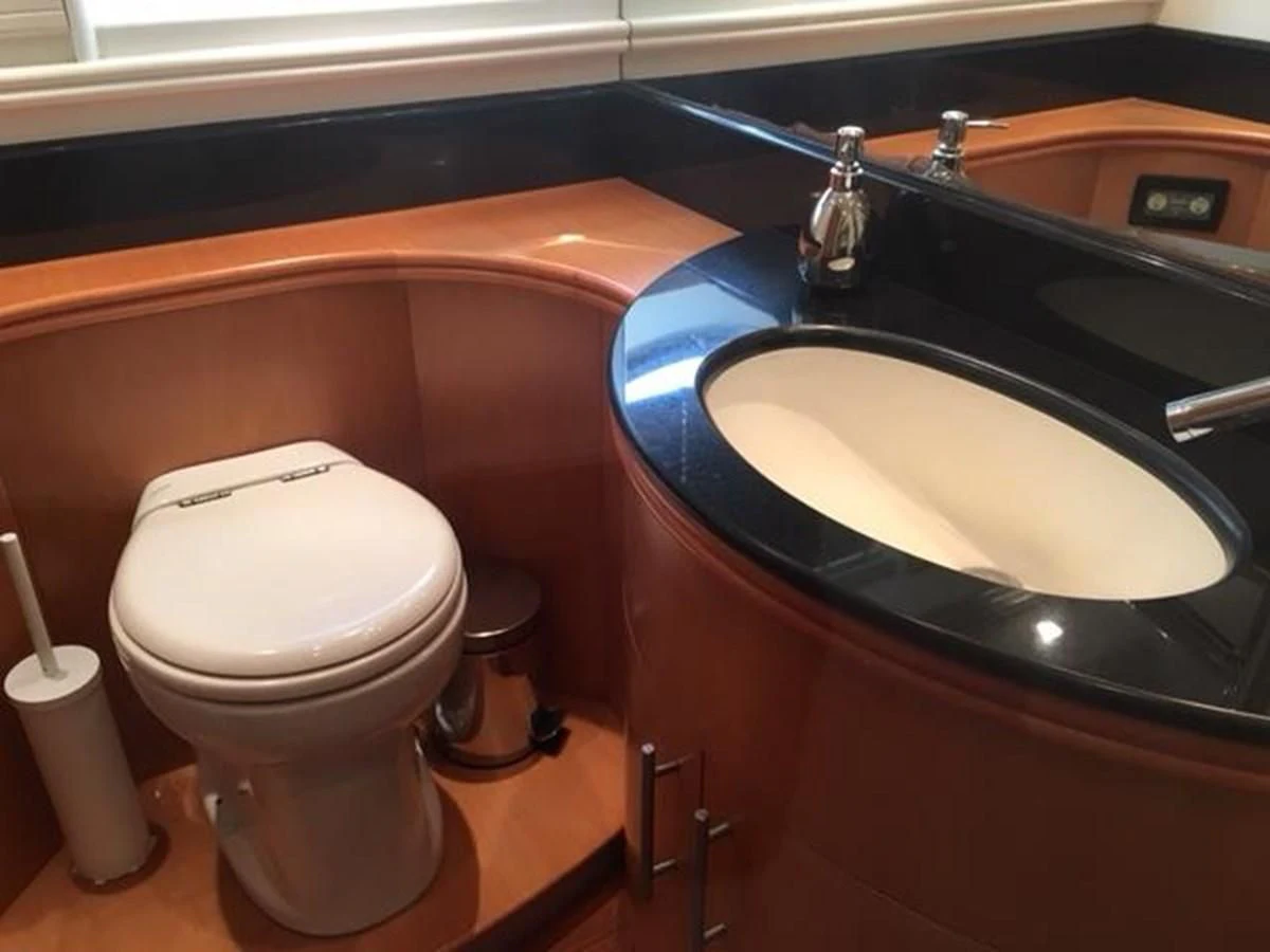 a sink and toilet in a bathroom aboard CHAKLOO Yacht for Sale