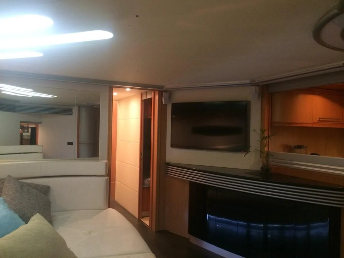a room with a bed and a television aboard CHAKLOO Yacht for Sale