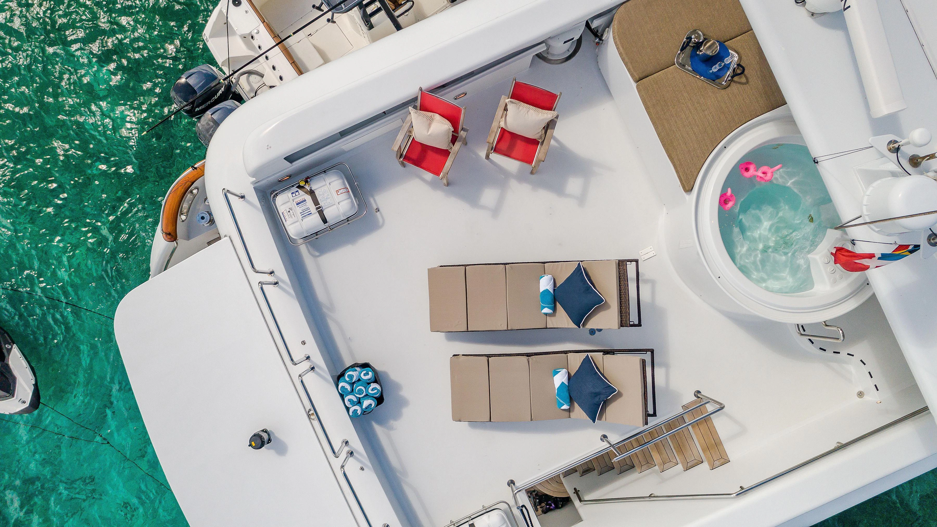 a white sink with a faucet and a mirror aboard CAPRICE I Yacht for Sale