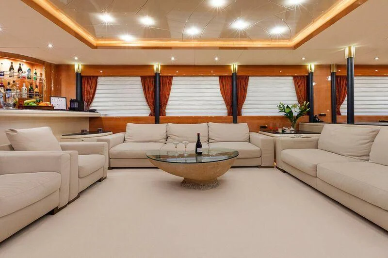a living room with a bowl of water on the table aboard CAPRICE I Yacht for Sale