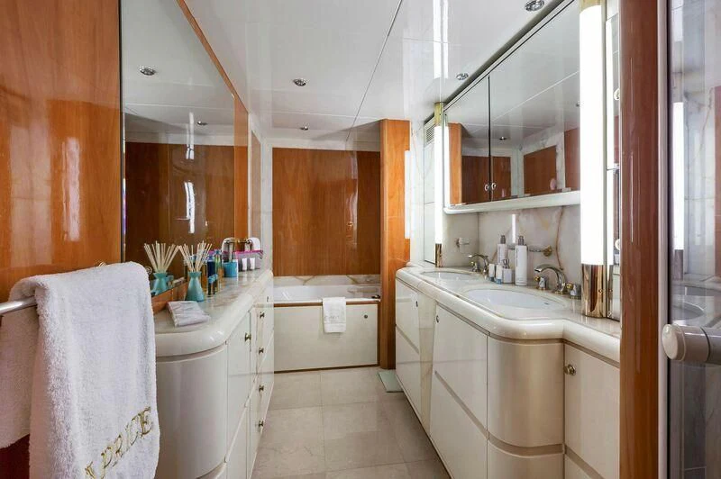 a bathroom with a sink and a mirror aboard CAPRICE I Yacht for Sale