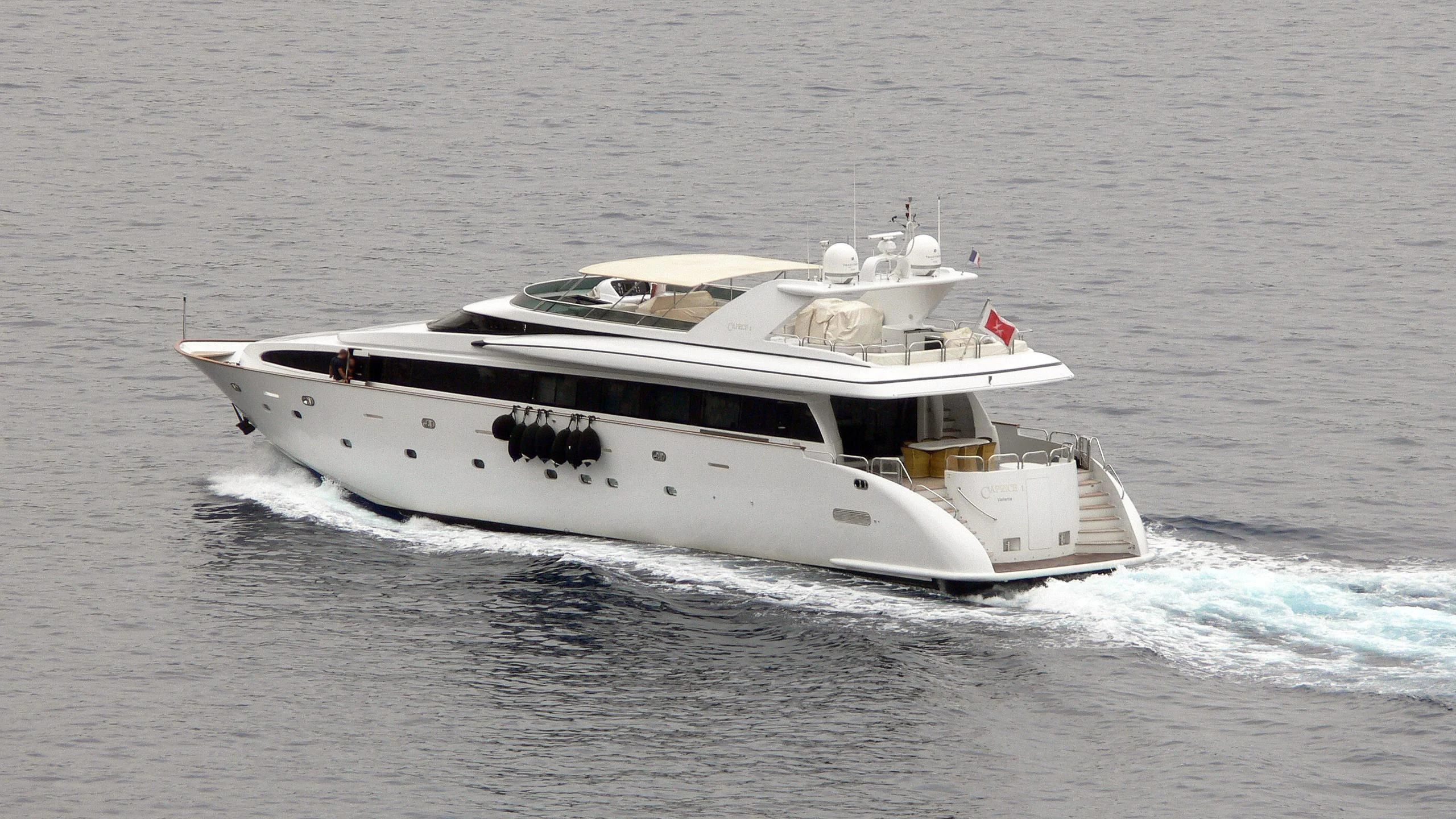 a white yacht in the water aboard CAPRICE I Yacht for Sale