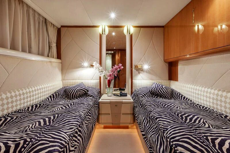 a room with a mirror and bed aboard CAPRICE I Yacht for Sale