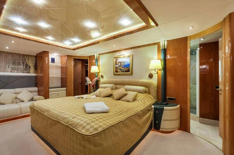 a large bedroom with a bed aboard CAPRICE I Yacht for Sale