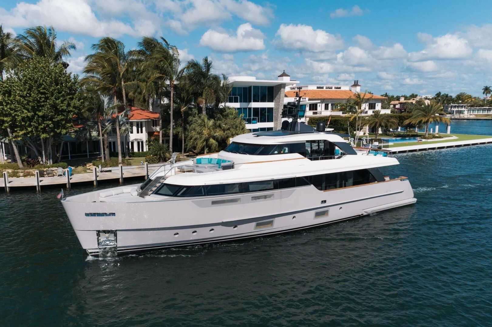 a white yacht in the water aboard DON'T TELL MOM Yacht for Sale