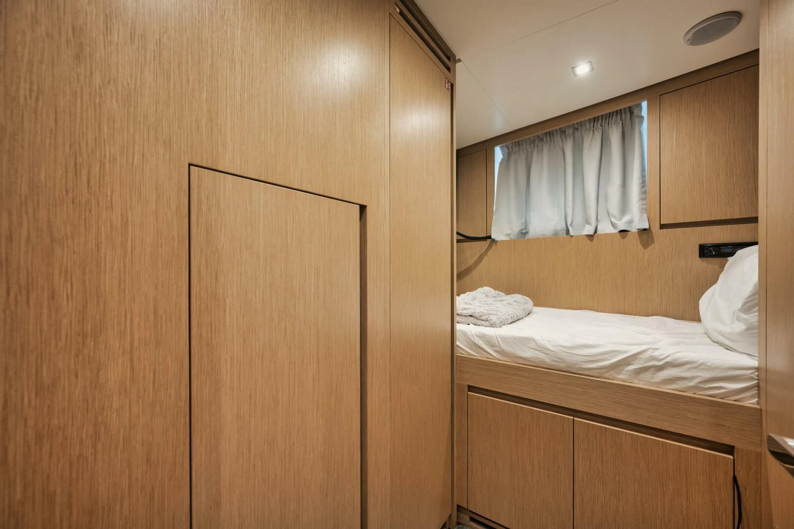 a room with a bed and a closet aboard DON'T TELL MOM Yacht for Sale