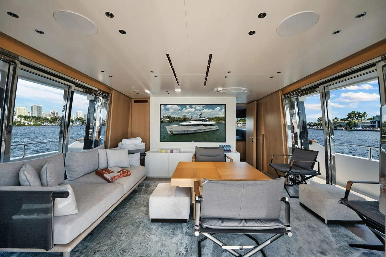 a living room with a large window aboard DON'T TELL MOM Yacht for Sale
