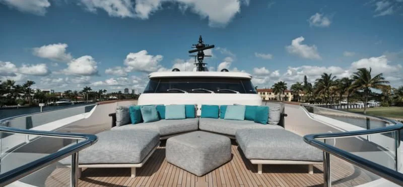 a large white boat with a pool in front of it aboard DON'T TELL MOM Yacht for Sale