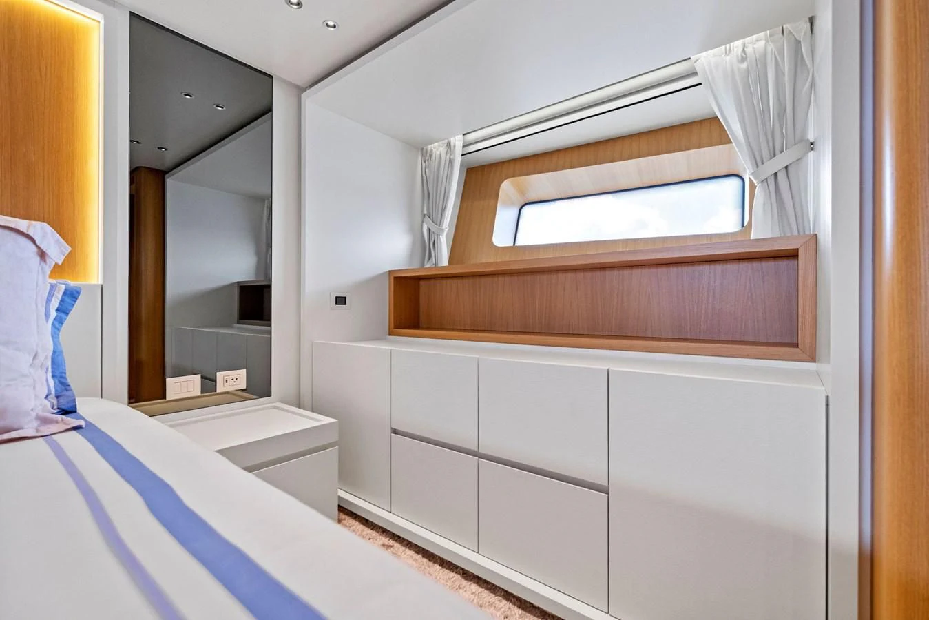a room with a mirror and a bed aboard DON'T TELL MOM Yacht for Sale