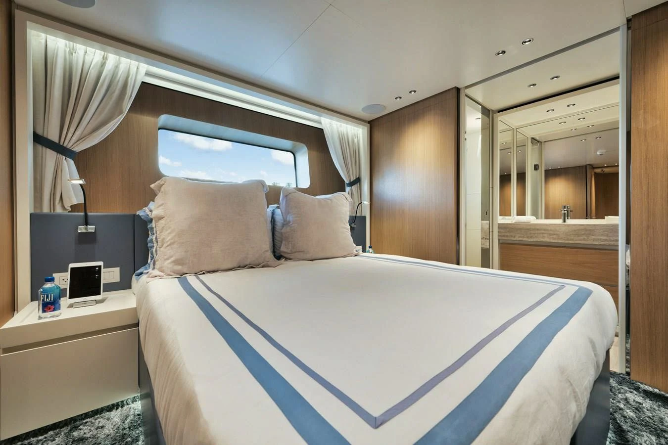 a bed with a blue sheet aboard DON'T TELL MOM Yacht for Sale